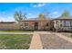 Charming stone-accented home with a well-maintained lawn and inviting curb appeal at 3251 N Adams St, Denver, CO 80205