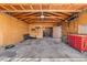 Spacious garage with exposed wood beams, concrete floor, and ample storage space at 3251 N Adams St, Denver, CO 80205