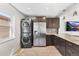Charming kitchen features granite countertops, stainless steel appliances, and convenient in-unit laundry at 3251 N Adams St, Denver, CO 80205