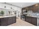 Contemporary kitchen boasts stainless steel appliances, island and sleek cabinetry at 3251 N Adams St, Denver, CO 80205