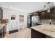 Updated kitchen featuring modern appliances, stylish countertops, and ample cabinet space at 3251 N Adams St, Denver, CO 80205