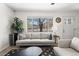 Cozy living room with stylish decor, a large window, and inviting natural light at 3251 N Adams St, Denver, CO 80205