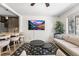 Open-concept living space with modern decor, TV, and easy access to the kitchen at 3251 N Adams St, Denver, CO 80205