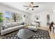 Bright living room featuring a large window, modern decor, and stylish furnishings at 3251 N Adams St, Denver, CO 80205