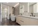 Modern bathroom features a soaking tub, dual vanity, and sleek black fixtures at 1901 Wazee St # 707, Denver, CO 80202