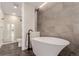 Modern bathroom featuring a sleek soaking tub and a separate glass-enclosed shower at 1901 Wazee St # 707, Denver, CO 80202