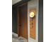 Modern condo front door with a wall light and clear numbering at 1901 Wazee St # 707, Denver, CO 80202