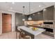 Sleek kitchen features a large island with barstool seating and modern appliances at 1901 Wazee St # 707, Denver, CO 80202