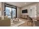 Bright living room with floor-to-ceiling windows and views of the cityscape at 1901 Wazee St # 707, Denver, CO 80202