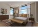 Bright main bedroom with large windows offering city views and natural light at 1901 Wazee St # 707, Denver, CO 80202