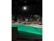 Stunning rooftop pool view under moonlight with a modern design and comfortable lounge seating at 1901 Wazee St # 707, Denver, CO 80202