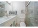 Modern bathroom with a sleek vanity, mirrored cabinet, and glass-enclosed shower at 3639 Pine Meadow Ave, Parker, CO 80138