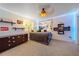 Well-lit bedroom featuring a cozy bed, decorative shelves, and personal touches at 3639 Pine Meadow Ave, Parker, CO 80138
