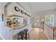 A kitchen featuring a large island with granite countertops and light wood flooring at 3639 Pine Meadow Ave, Parker, CO 80138
