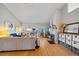 Bright and inviting living room with hardwood floors, stone fireplace, and lots of natural light at 3639 Pine Meadow Ave, Parker, CO 80138