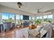 Bright living room with large windows offering great views and hardwood flooring at 3639 Pine Meadow Ave, Parker, CO 80138
