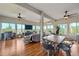 Open-concept living area flows into the dining area with hardwood floors and great natural light at 3639 Pine Meadow Ave, Parker, CO 80138