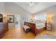 Bright main bedroom with hardwood floors, natural light, and a walk-in closet at 3639 Pine Meadow Ave, Parker, CO 80138