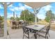 Outdoor kitchen with a built-in grill, bar seating, and elegant patio furniture at 3639 Pine Meadow Ave, Parker, CO 80138