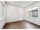 Bright bedroom with hardwood floors, large windows, and modern finishes at 2464 Wesley Ln, Lafayette, CO 80026