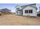 Exterior view of a charming two-story home with large windows and a well-sized yard at 2464 Wesley Ln, Lafayette, CO 80026