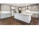 Modern kitchen with a large island, stainless steel appliances, and sleek cabinetry at 2464 Wesley Ln, Lafayette, CO 80026