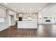 Open kitchen with a large island, stainless steel appliances, and hardwood floors at 2464 Wesley Ln, Lafayette, CO 80026