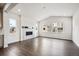 Spacious living room featuring a fireplace, hardwood floors, and bright windows at 2464 Wesley Ln, Lafayette, CO 80026
