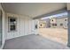 An open-air covered patio perfect for outdoor relaxation and entertaining on a bright day at 2464 Wesley Ln, Lafayette, CO 80026