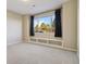 Bedroom featuring a built-in window seat with storage and a treetop view at 11830 Bell Cross Cir, Parker, CO 80138