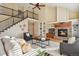 Two-story living room featuring a fireplace and hardwood floors at 11830 Bell Cross Cir, Parker, CO 80138