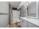 Cozy bathroom featuring tiled floors, a shower-tub, and modern vanity at 12143 Melody Dr # 103, Denver, CO 80234