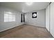 Bedroom with neutral carpet and large mirror at 12143 Melody Dr # 103, Denver, CO 80234