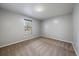 Neutral bedroom showcasing wall-to-wall carpeting and a window bringing in natural light at 12143 Melody Dr # 103, Denver, CO 80234