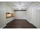 Dining area featuring hardwood floors, ceiling fan, and adjacent breakfast bar at 12143 Melody Dr # 103, Denver, CO 80234