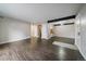 Inviting living room with sleek floors and a view into the dining area at 12143 Melody Dr # 103, Denver, CO 80234