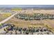 Beautiful aerial view of the neighborhood and surrounding landscape with schools nearby and mountain views at 2675 Timberchase Trl, Highlands Ranch, CO 80126