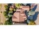 Aerial view of the home showcasing its roofline, surrounding trees, and expansive lot at 2675 Timberchase Trl, Highlands Ranch, CO 80126