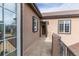 Private balcony featuring stucco walls and wrought iron railing, perfect for relaxing outdoors at 2675 Timberchase Trl, Highlands Ranch, CO 80126