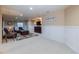 Finished basement with seating area, TV, and built-in shelving at 2675 Timberchase Trl, Highlands Ranch, CO 80126