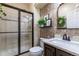 Bathroom with shower, vanity, and floral wallpaper at 2675 Timberchase Trl, Highlands Ranch, CO 80126