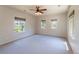 Spacious bedroom with ceiling fan, neutral walls and carpeted floor, plus natural light and windows at 2675 Timberchase Trl, Highlands Ranch, CO 80126