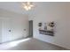 Bright bedroom with ceiling fan, decorative mantle and closet at 2675 Timberchase Trl, Highlands Ranch, CO 80126