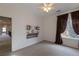 Simple bedroom with ceiling fan, decorative mantle and closet at 2675 Timberchase Trl, Highlands Ranch, CO 80126