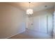 Bright bedroom with neutral walls, carpeted floor and closet space with a chandelier centerpiece at 2675 Timberchase Trl, Highlands Ranch, CO 80126