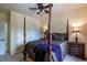 Guest bedroom with a post bed and ceiling fan at 2675 Timberchase Trl, Highlands Ranch, CO 80126