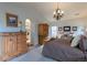 Spacious bedroom with large windows and decorative wooden furniture at 2675 Timberchase Trl, Highlands Ranch, CO 80126