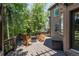 Inviting wooden deck with seating, ideal for outdoor entertaining amidst lush greenery at 2675 Timberchase Trl, Highlands Ranch, CO 80126