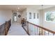 Upstairs hallway with high ceilings and natural light at 2675 Timberchase Trl, Highlands Ranch, CO 80126