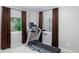 Home gym with treadmill and window views at 2675 Timberchase Trl, Highlands Ranch, CO 80126